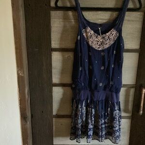 Navy Blue Sleeveless Dress with Floral Accents